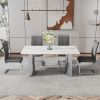 Modern minimalist dining table. White imitation marble glass sticker desktop, stainless steel legs, stable and beautiful. Suitable for living room and