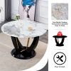 A modern minimalist circular Pandora style sintered stone table top with a diameter of 48 inches, paired with black MDF legs. Suitable for restaurants